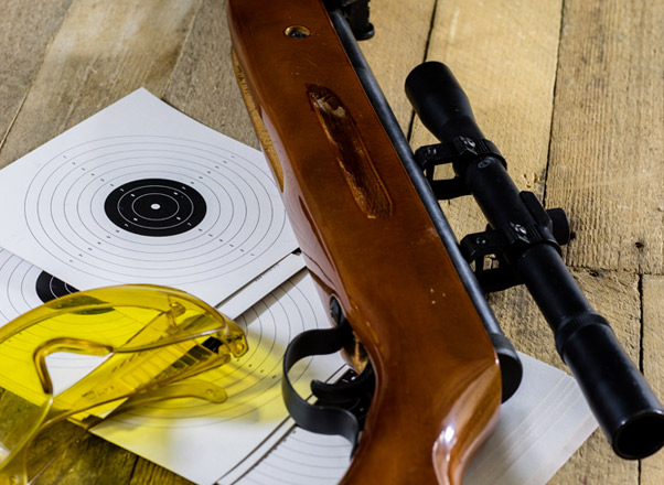 small-rifle-target-and-glasses-on-table